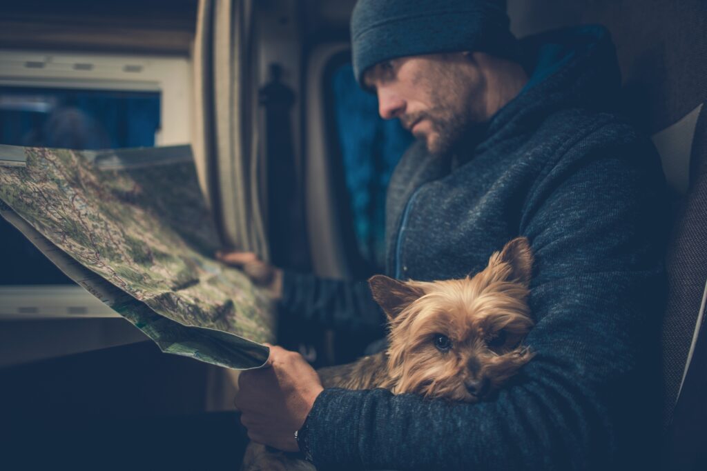 Grab your pet and hit the road in your RV, booking "unlimited stays at unique camping locations" with Harvest Hosts.